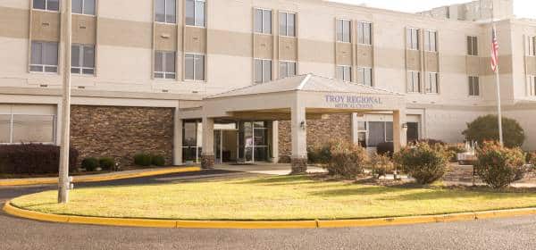 an empty parking lot in front of a building