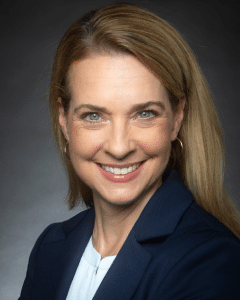 a woman smiling for the camera a woman smiling for the camera