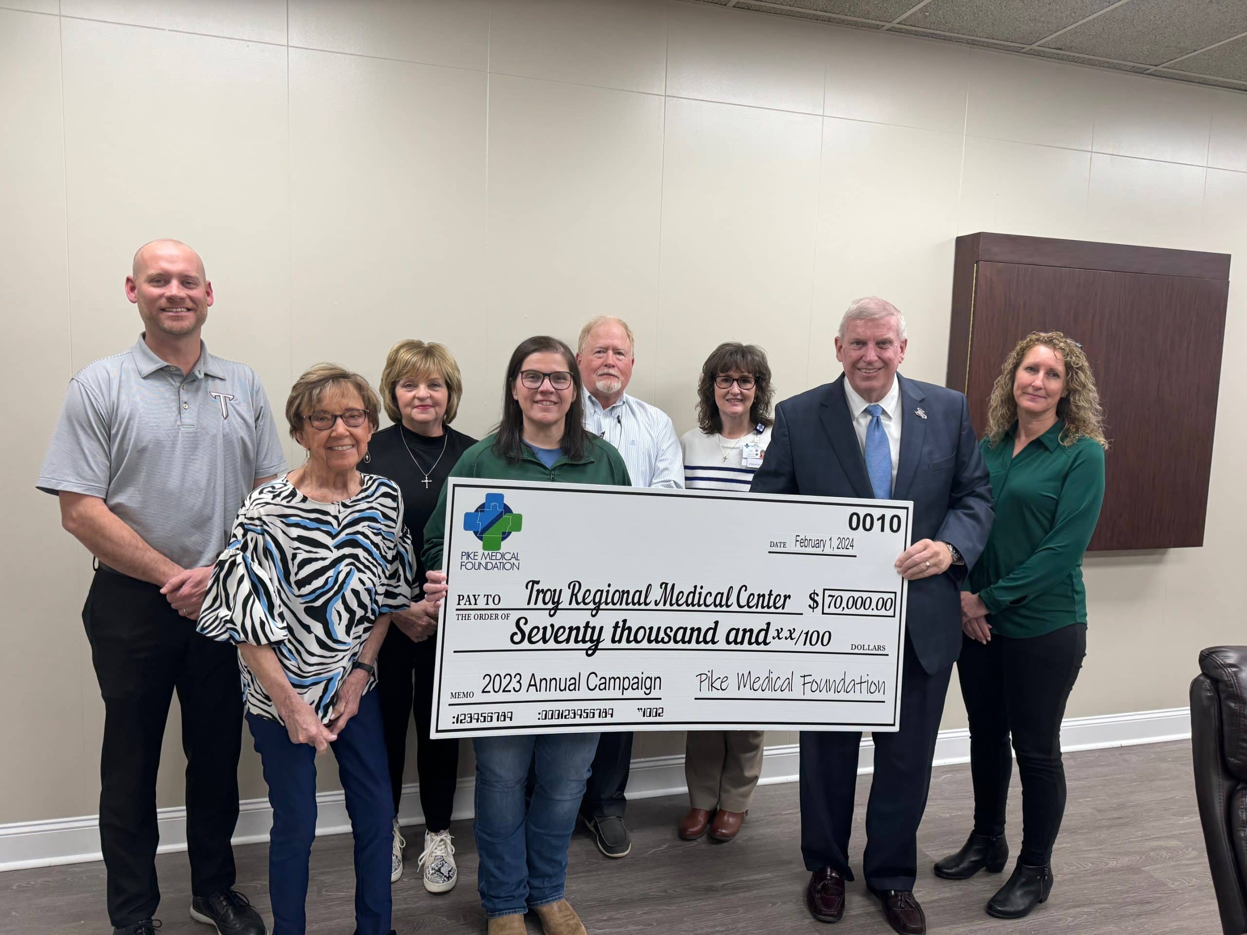 a group of people posing for the camera