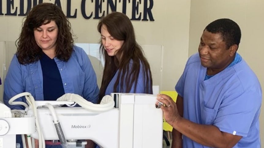a man standing next to a woman